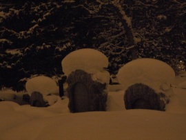 Tombstones with snow-wigs