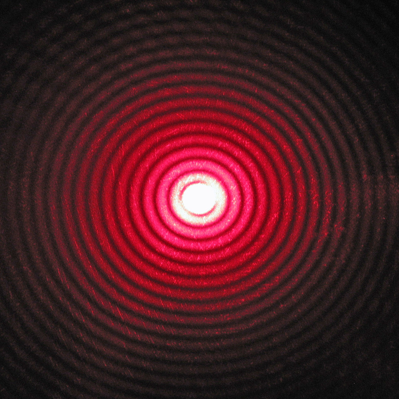 Light diffraction pattern. Concentrical rings of light.